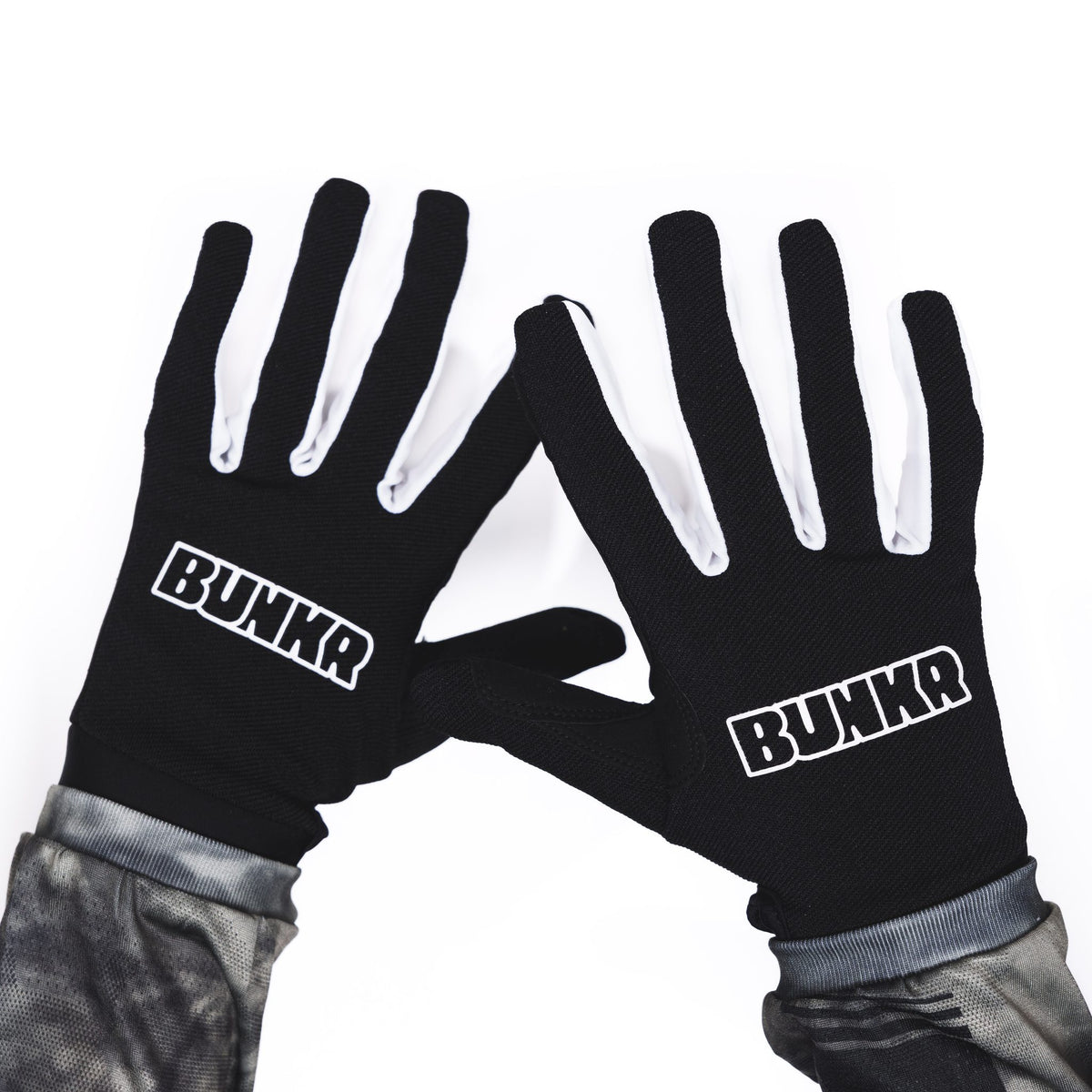 Pair of BUNKR Gloves black and white MX riding gloves